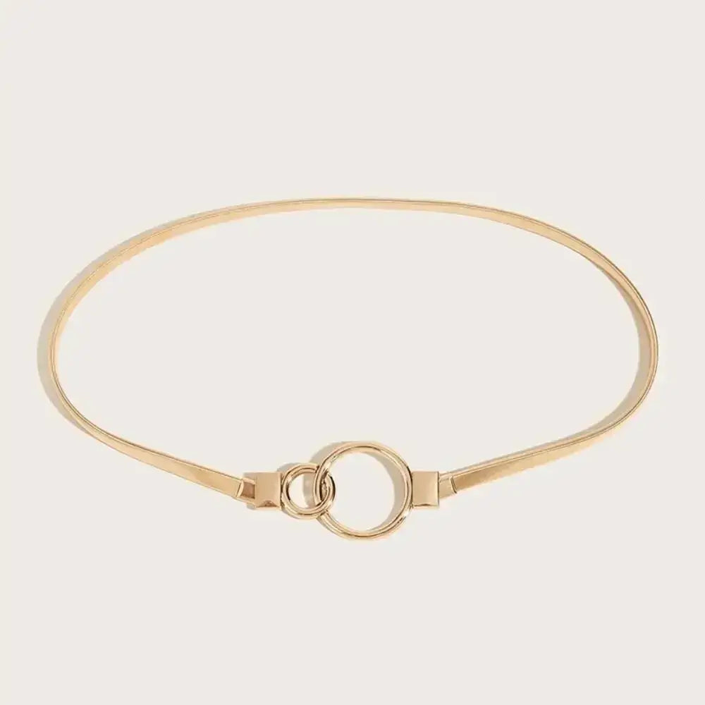 Cinto Feminino de Metal Fino em formato circular sobre fundo claro, mostrando o fechamento por encaixe