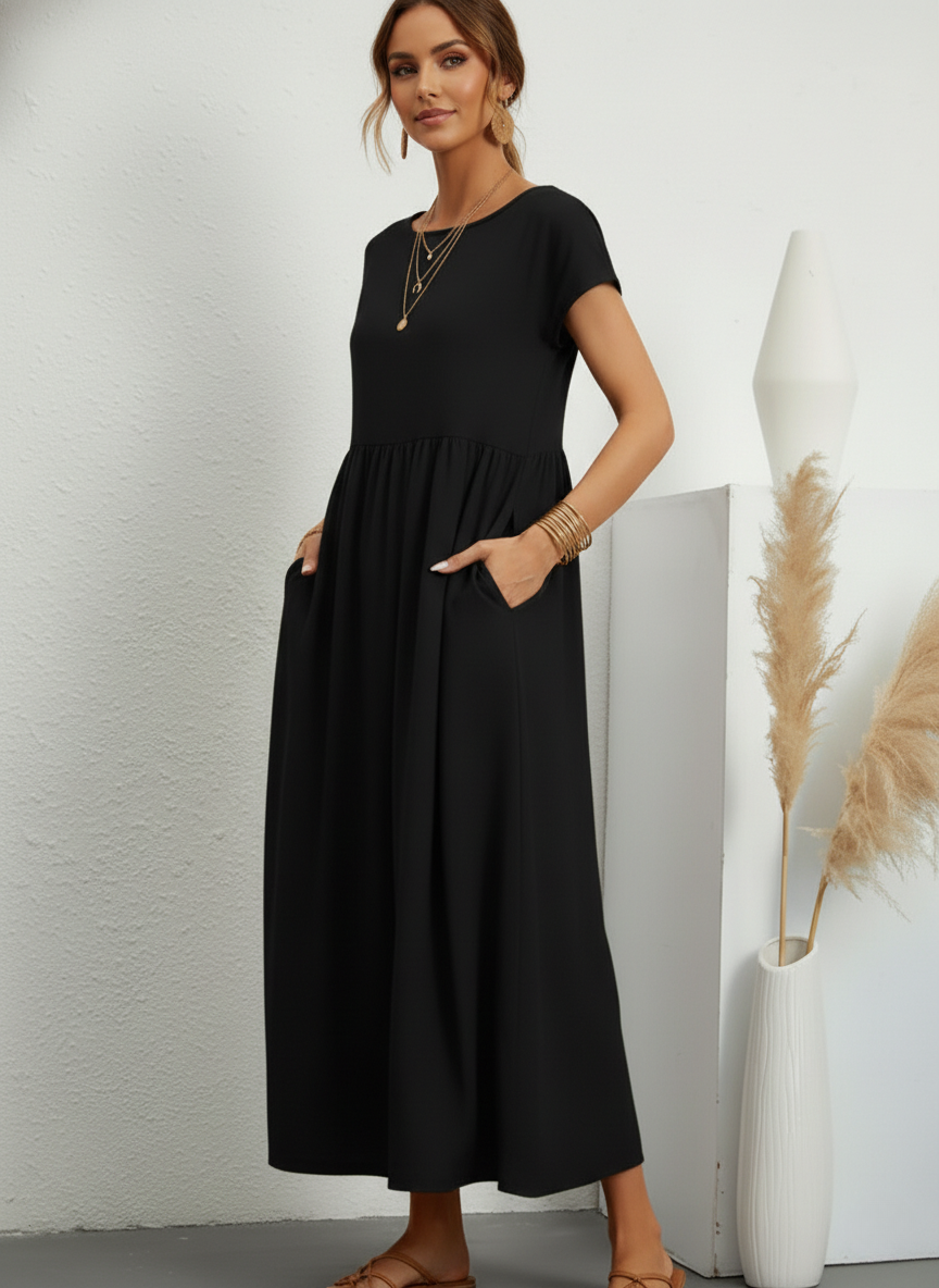 Vestido Midi Feminino Preto de Algodão e Linho Estilo Vintage com Bolsos em pose de três quartos, com as mãos nos bolsos